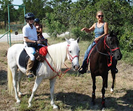 TTC 06/2011 at LBJ Grasslands - 2 riders on white and black horses